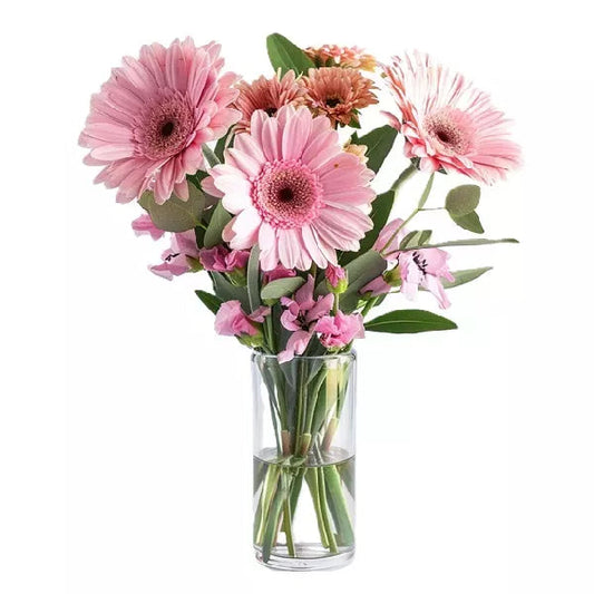 photo of pink gerberas in a clear glass vase