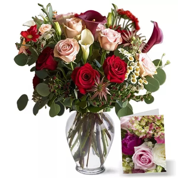 A variety of roses and flowers in a glass vase with a small image inset.