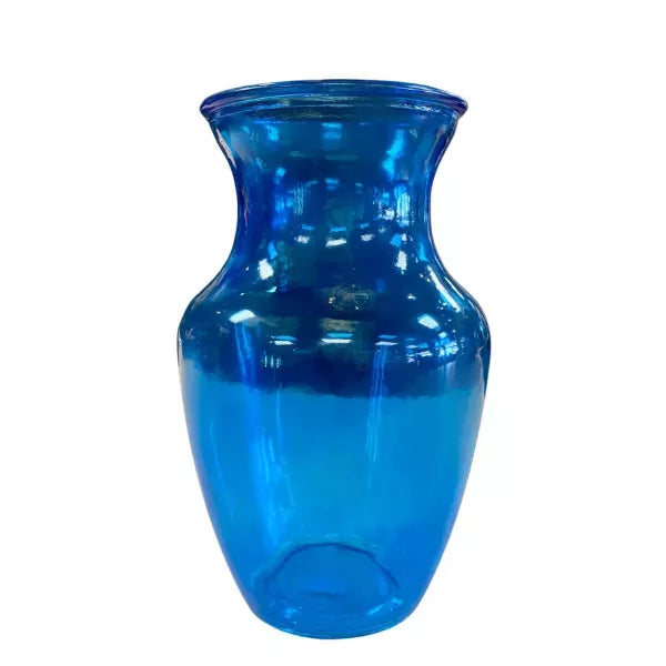 A vibrant blue glass vase against a white background.