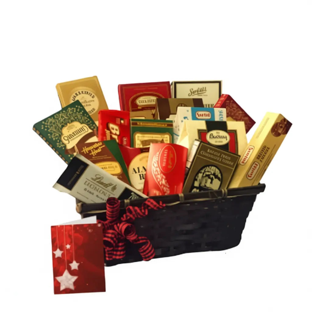 Christmas gourmet gift basket with assorted chocolates, truffles, and sweets in a black basket with red ribbon and holiday card.