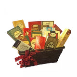 A basket filled with assorted chocolate bars and a red bow.