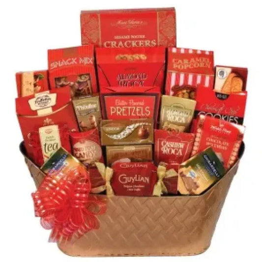 Gift basket filled with various packaged gourmet snacks and a red bow on the side.
