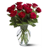 red rose bouquet in a clear glass vase